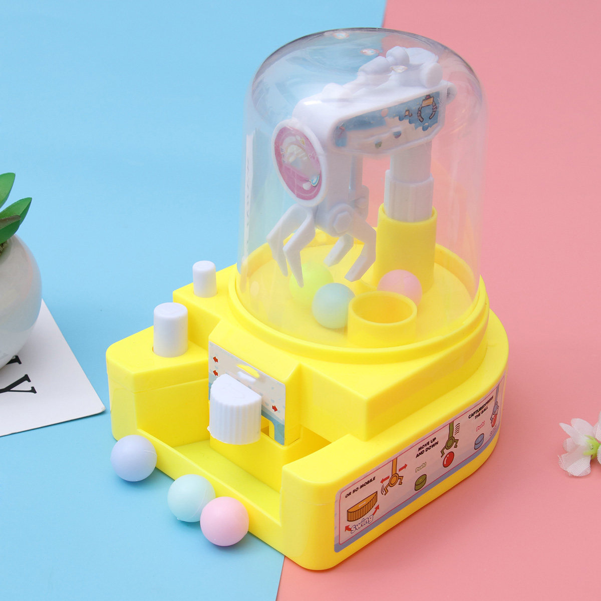 Claw Crane Machine - เครื่องคีบลูกอม 1 ชิ้น ทำจากพลาสติกคุณภาพสูง แขนกลขนาดเล็กแบบมือถือ เกมเครนสำหรับเด็ก